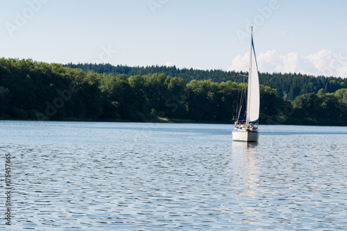 Small yacht sailing on Lipno lake