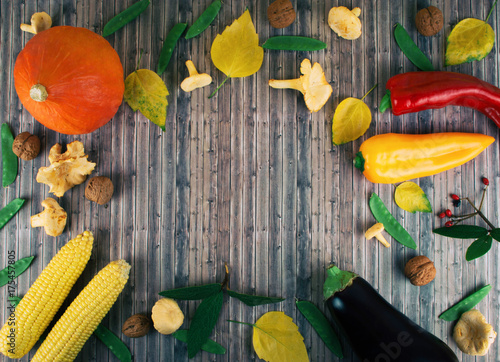 Fresh autumn seasonal vegetables on wooden background.