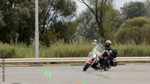 Great motorcycle maneuvering between the cones, exercise biker photo