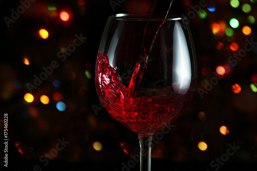Beautiful splash of red wine in a glass