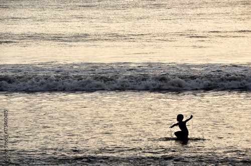 Wallpaper Mural Kid silhouette on beach Torontodigital.ca