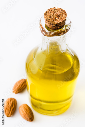 Almond oil in bottle isolated on white background