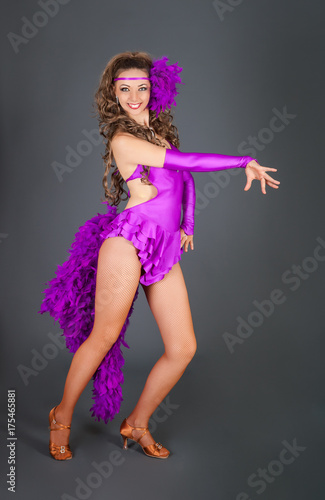 Beautiful Lady in Violet Costume Dances in Studio