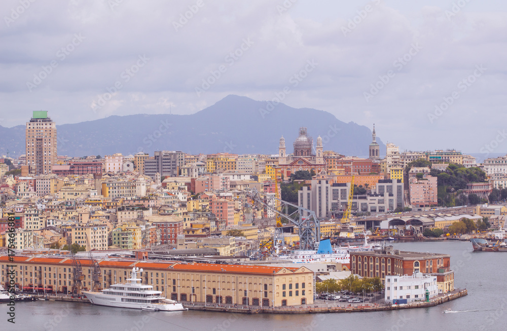 view of old port in Genoa the major Italian seaport on the Mediterranean Sea with cityscape of Genoa town.
