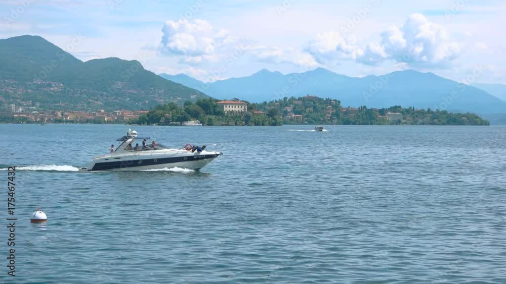 People on boat lake Maggiore. Summer in Italy, picturesque view. People on boat lake Maggiore. Summer in Italy, picturesque view.