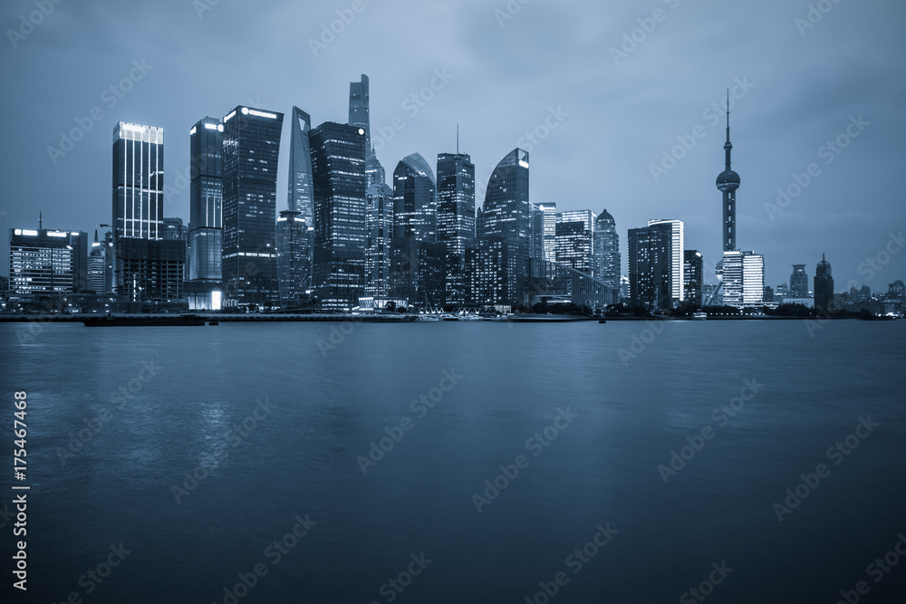Shanghai skyline at night, China, blue tone.