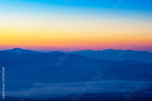 Beautiful silhouette mountains sunrise at Doi Inthanon National Park. Chiang Mai, Thailand. © Nischaporn