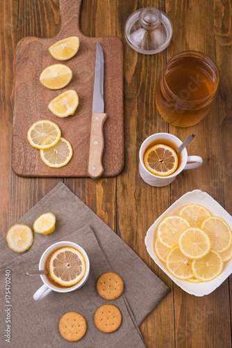 Composition with lemon tea on a wooden table