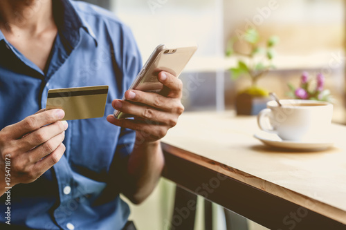 Man using mobile smartphone and credit card. Shopping Online