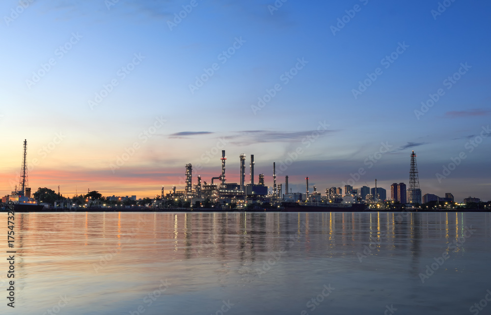 oil refinery along the river at sunrise oil refinery along the river at sunrise