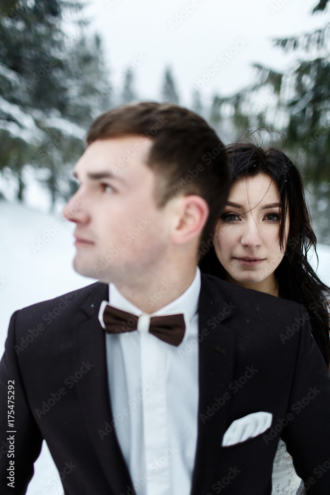 Wedding winter, bride and groom walking at winter wedding day Wedding winter, bride and groom walking at winter wedding day