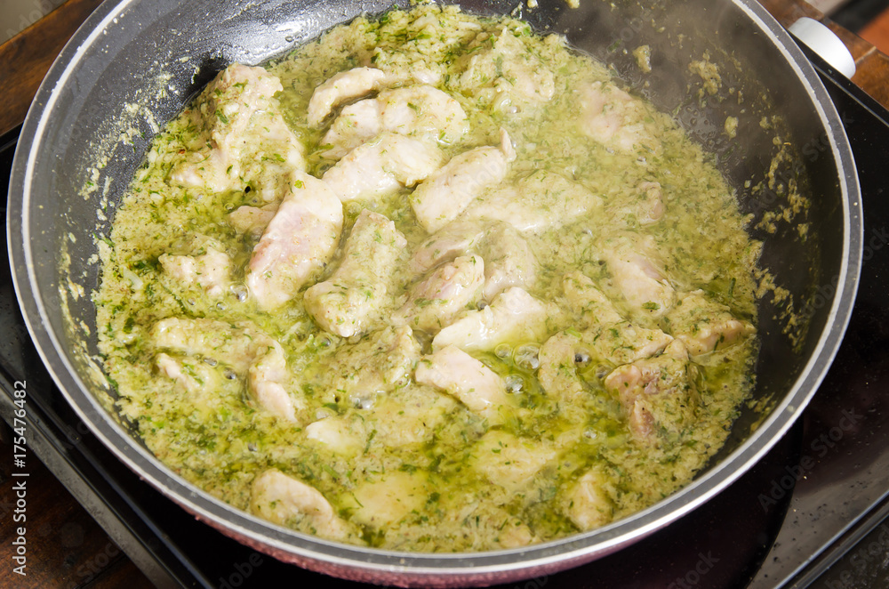 Thai food cooking,green curry with pork cooking in a pan Thai food cooking,green curry with pork cooking in a pan