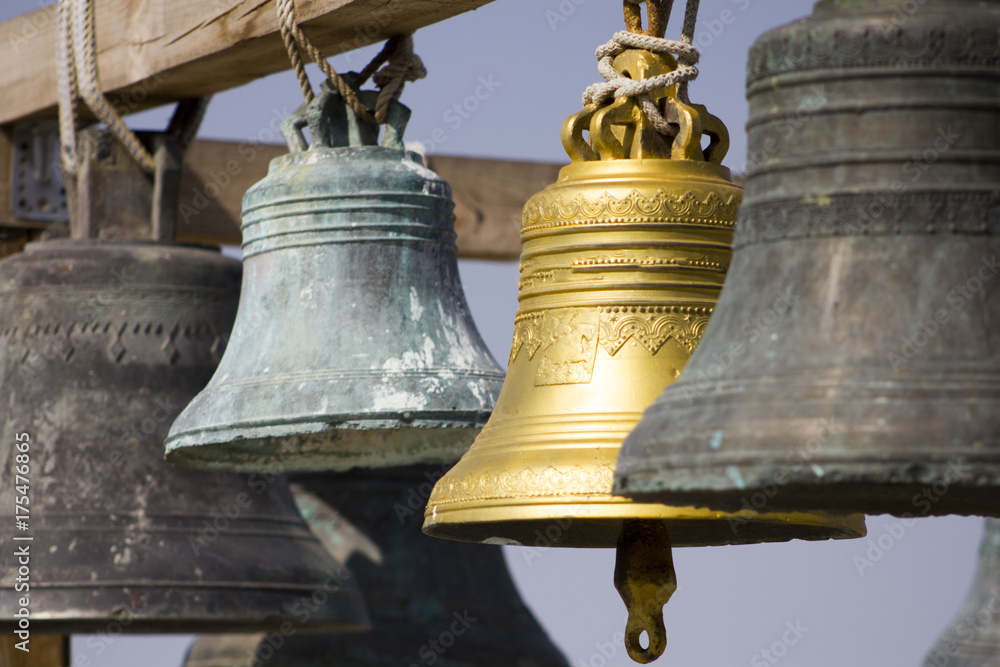 large Church bells hanging outside large Church bells hanging outside