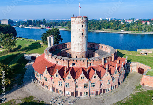 Medieval Wisloujscie Fortress with old lighthouse tower in port of Gdansk, Poland A unique monument of the fortification works. Aerial view
