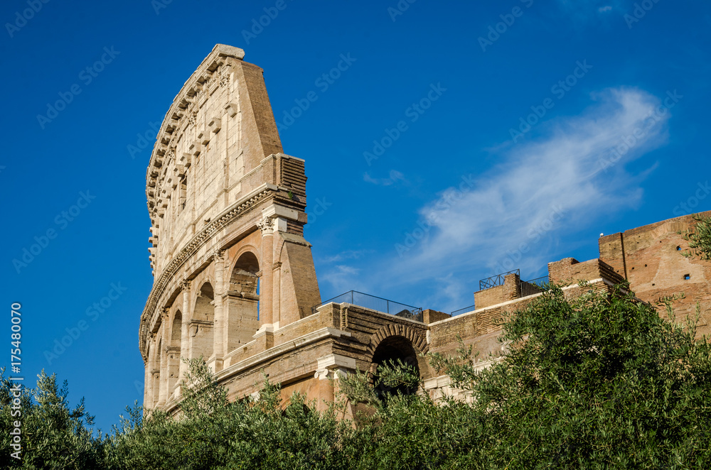 Detail of the wall of the Colosseum in a bright sunny summer day in Rome, Italy