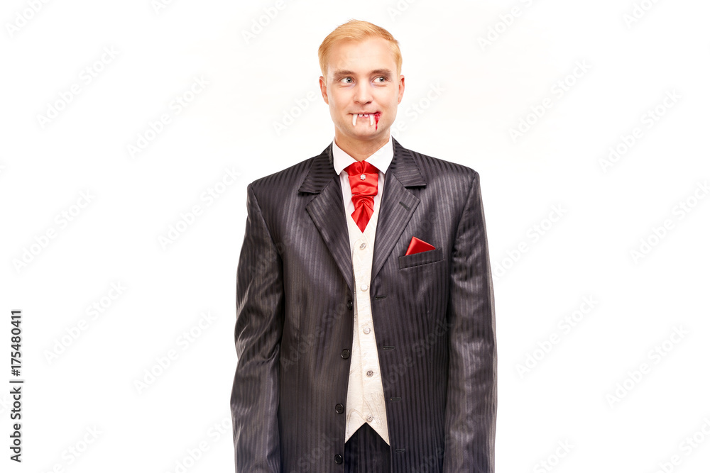 Portrait of handsome young vampire against white background Portrait of handsome young vampire against white background