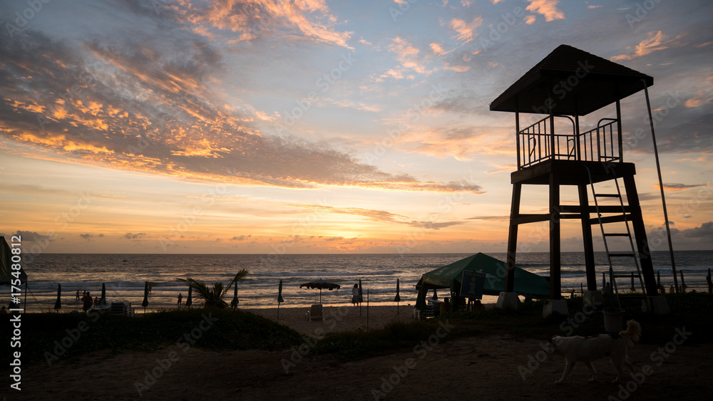 Silhouette life guard tower on the beach with colorful sunset . Silhouette life guard tower on the beach with colorful sunset .