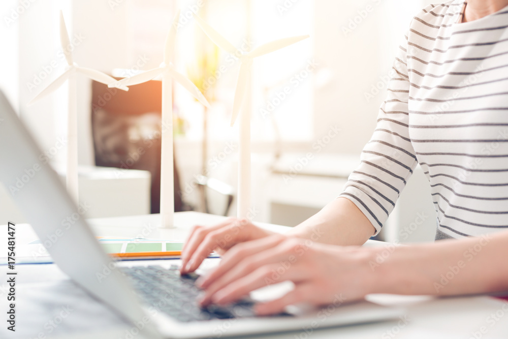 Nice pleasant woman typing on the keyboard Nice pleasant woman typing on the keyboard