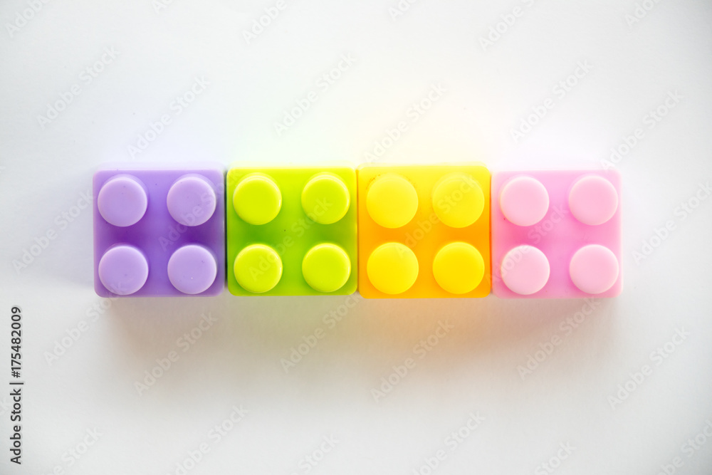 Multi color square plastic toy block on white background Multi color square plastic toy block on white background