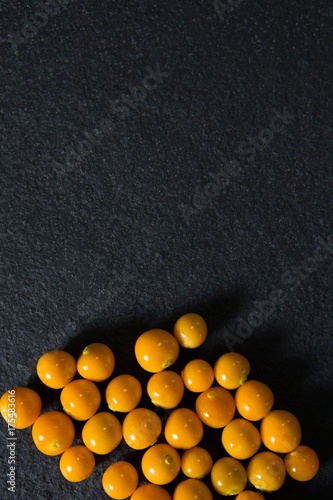 Golden berries on black background