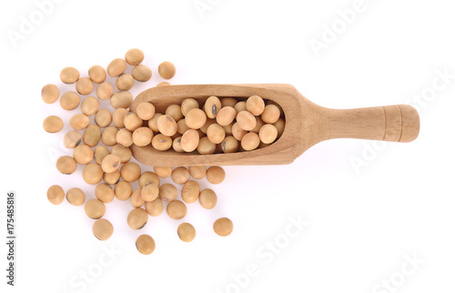 Soybean in wooden scoop isolated on white background