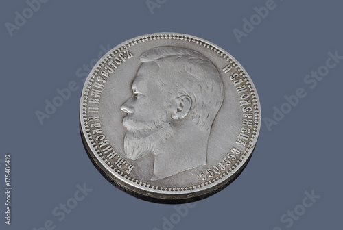 Old Russian silver ruble coin on dark background