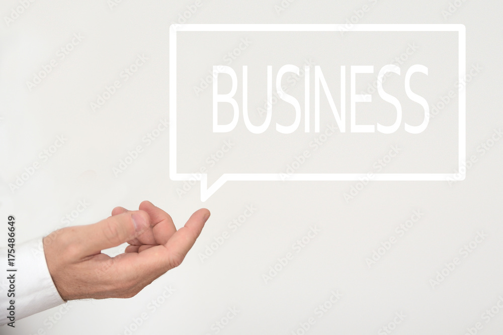 Businessman hand and a speech bubble with the word BUSINESS in. Empty copy space for Editor's text. Businessman hand and a speech bubble with the word BUSINESS in. Empty copy space for Editor's text.