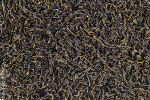 Close-up of black tea dry leaves. texture