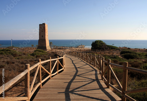 Cabopino beach with sea view and old tower, Marbella, Malaga, Spain