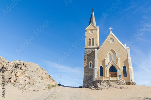 Famous German colonial church Felsenkirche on hill in desert town Luderitz, Namibia, Southern Africa
