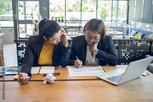 Business women are feeling stressed while working hard in their work.