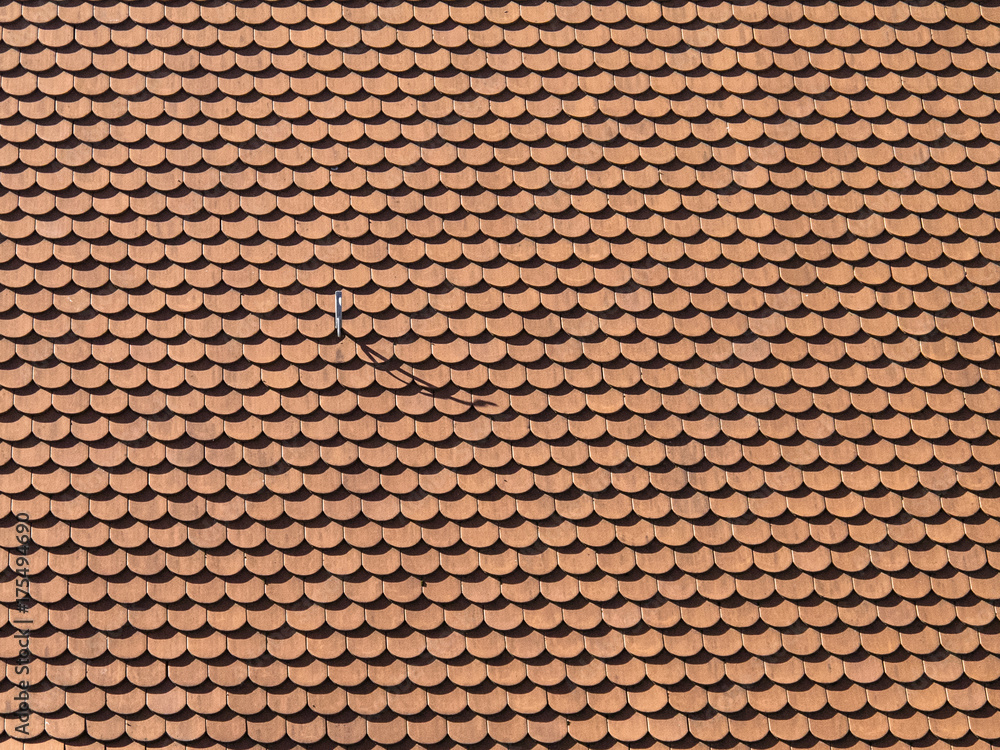 Background made from rooftiles with a hook throwing a shadow Background made from rooftiles with a hook throwing a shadow