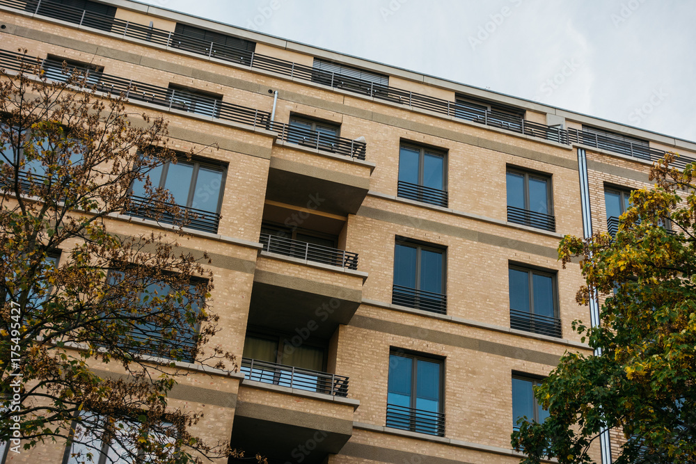 Fototapeta premium detailed view of orange apartment building