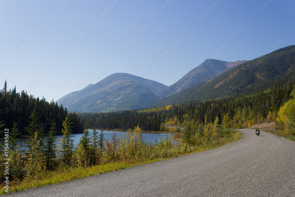 Wilderness View of Motorbike Riding the Remote Cassiar Highway, British Columbia, Canada