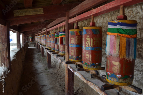 The Tibetan kora or pilgrimage and prayer wheels in Langmusi, Amdo Tibet - China