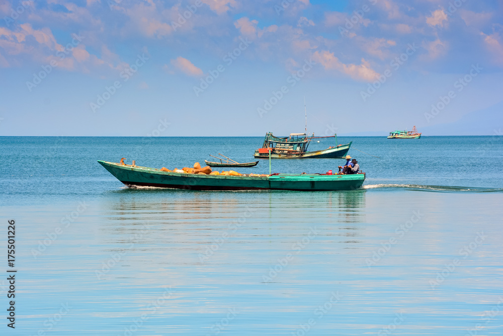 Vietnamese Fishing Boats in Tranquil Sea up to Skyline