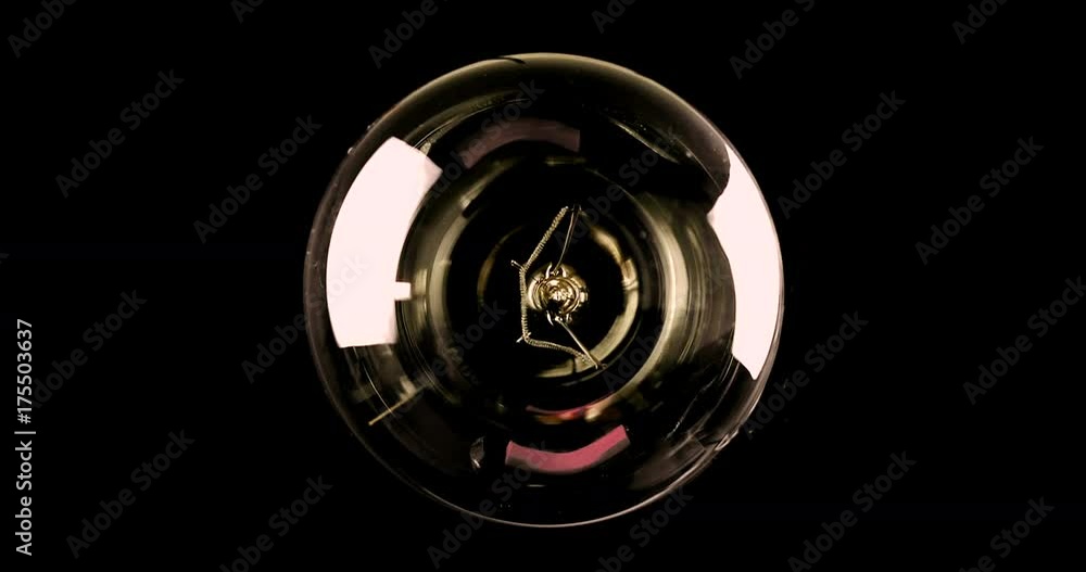 turn on and turn off, with blinking effect, retro vintage light bulb with tungsten technology built-in on warm light yellow tint and black background, old style atmosphere concept turn on and turn off, with blinking effect, retro vintage light bulb with tungsten technology built-in on warm light yellow tint and black background, old style atmosphere concept