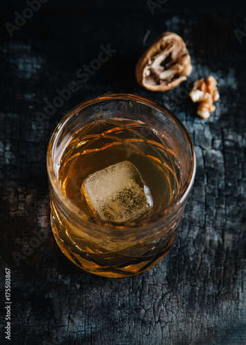 Old fashioned cocktail on dark moody background 