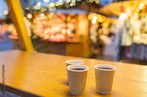 mulled wine in paper cups at christmas market