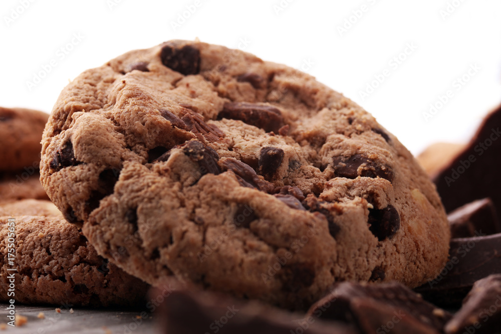 Fototapeta premium Chocolate cookies on wooden table. Chocolate chip cookies shot.