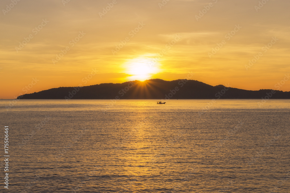 Beatiful sunrise on the mountain with boat from veiw pointat. Khaolamya sea. Rayong province, Thailand