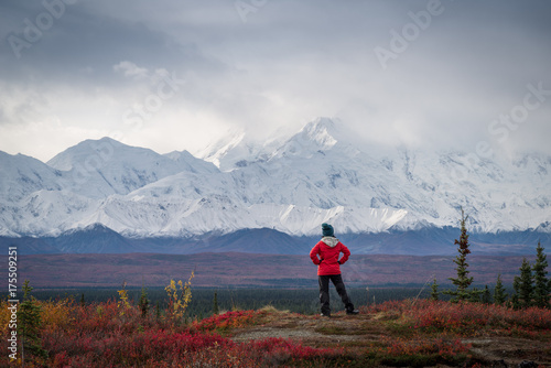 Hiker posing in front of Mount Denali