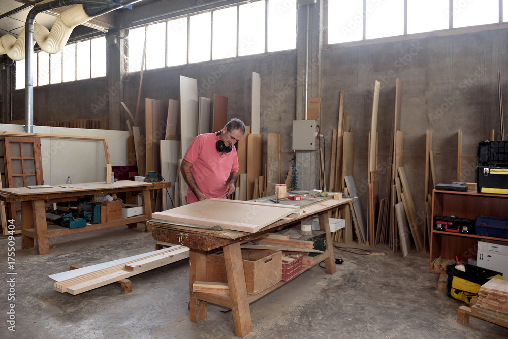 a carpenter working in his workshop a carpenter working in his workshop
