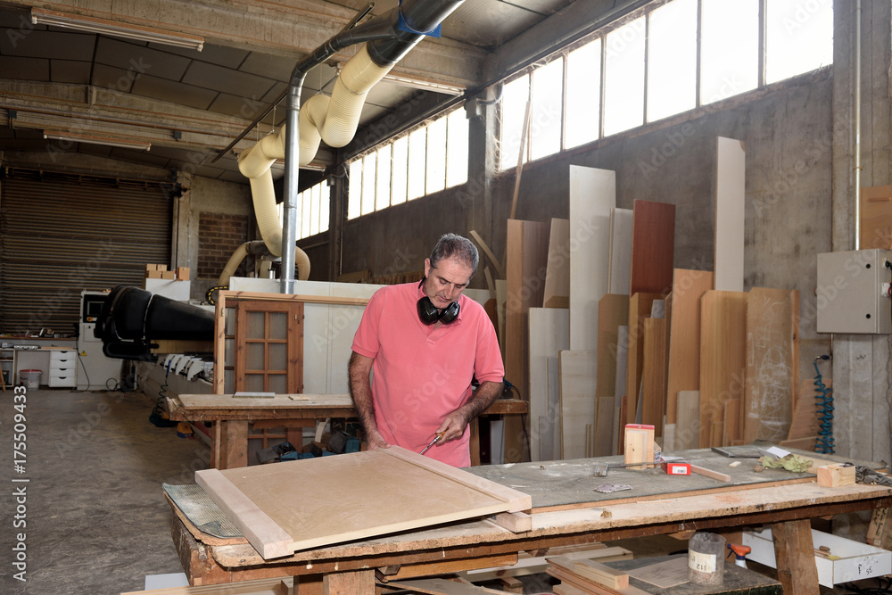a carpenter working in his workshop a carpenter working in his workshop