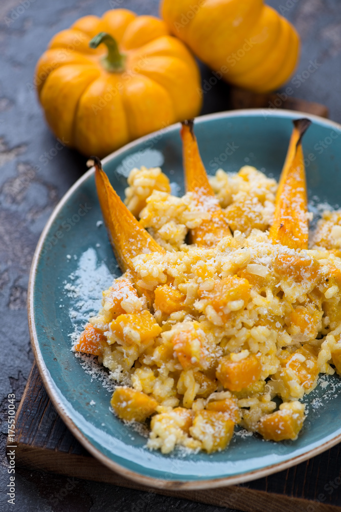 Risotto with pumpkin and parmesan, close-up, selective focus, vertical shot Risotto with pumpkin and parmesan, close-up, selective focus, vertical shot
