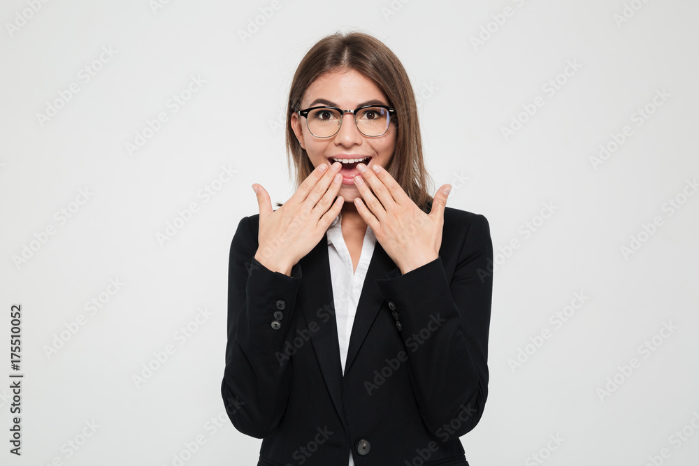 Portrait of a excited businesswoman in suit and eyeglasses Portrait of a excited businesswoman in suit and eyeglasses