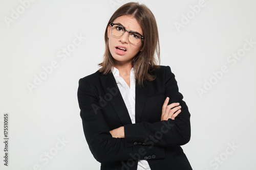 Portrait of a pretty frustrated businesswoman in suit