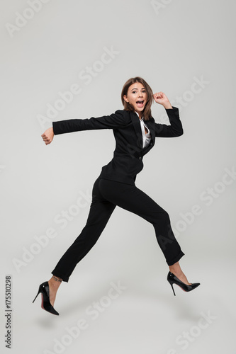 Full length portrait of crazy busy businesswoman in suit