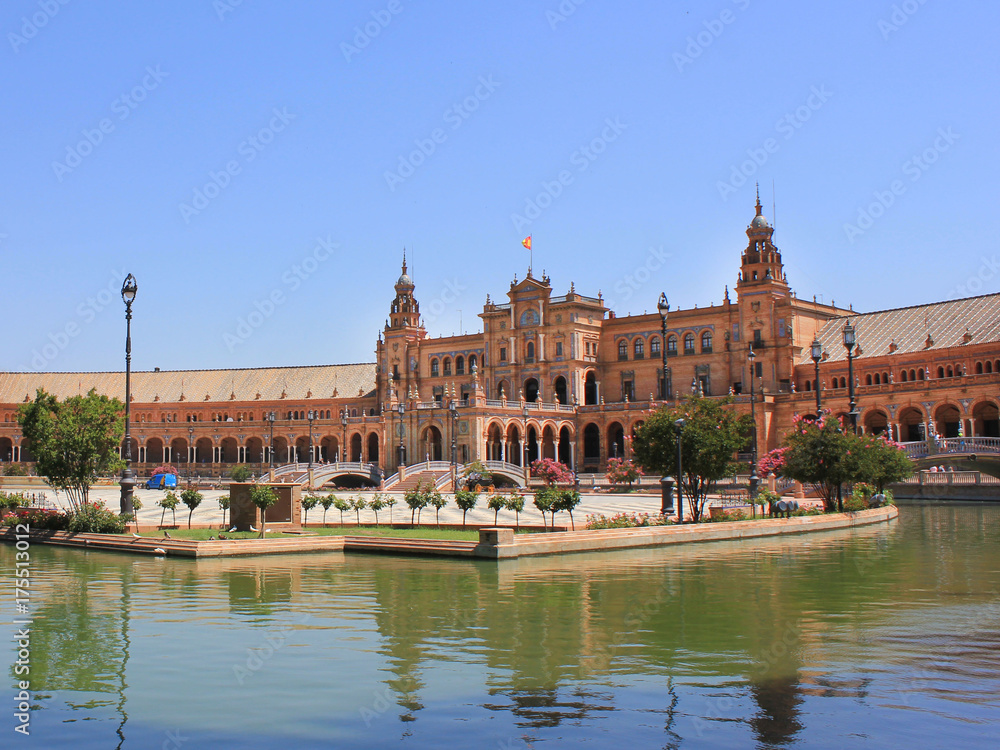 Plaza de Espana world famous Square in Seville. Renaissance Revival style in Spanish architecture. Buildings complex with wide walkways and no people on summer sunny day scene with empty copy space