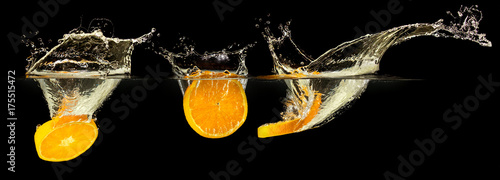 Group of fresh fruits falling in water